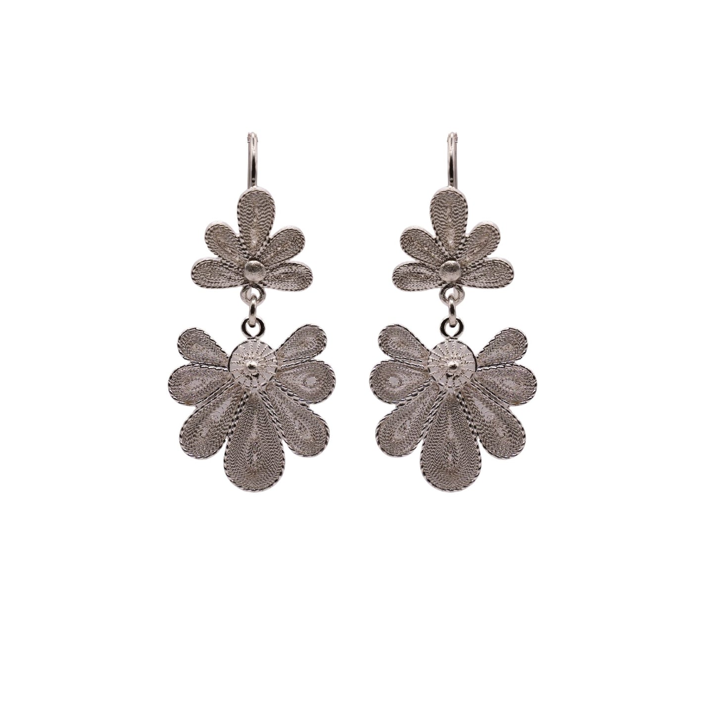 Pair of silver floral earrings on a white background