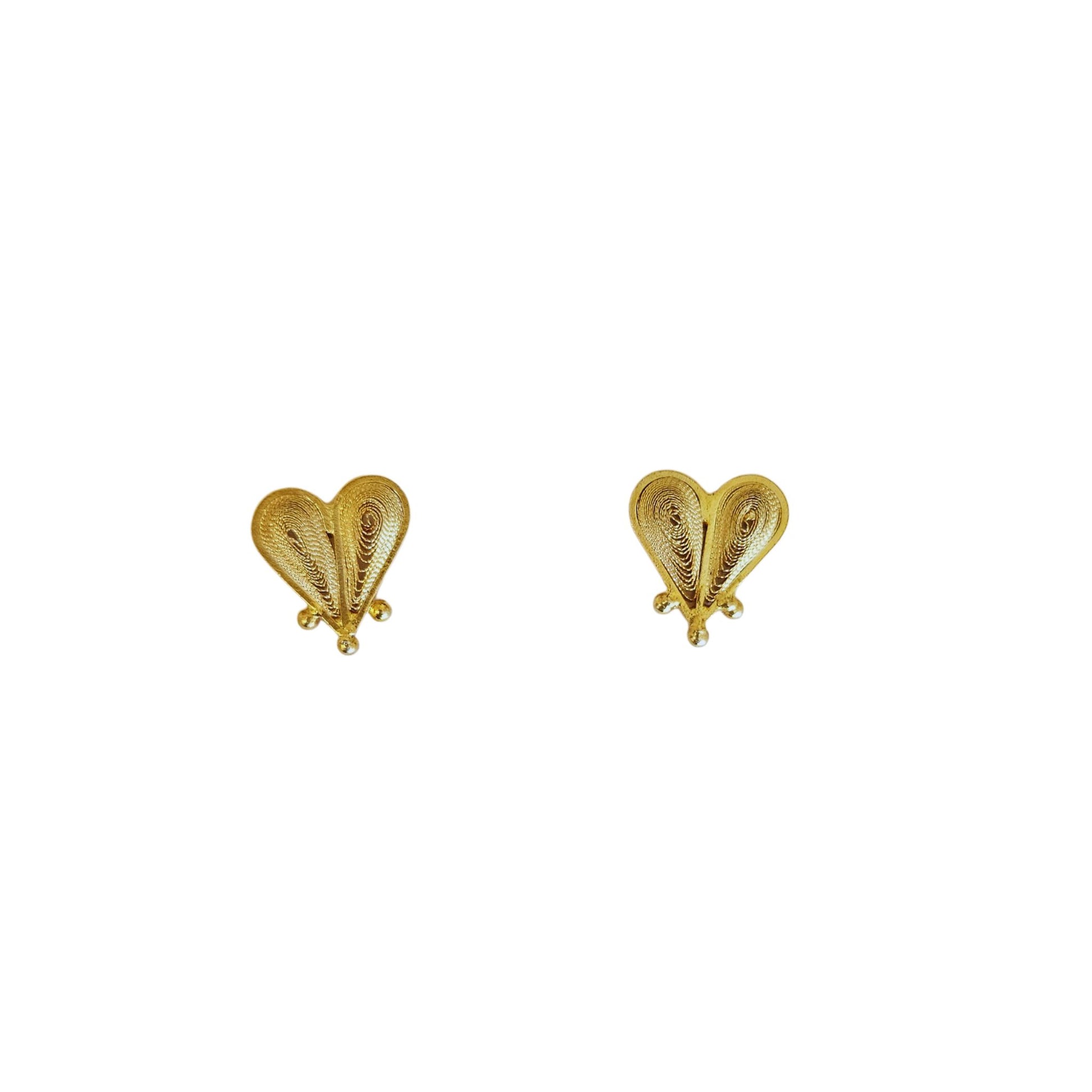 Gold heart-shaped earrings on a white background