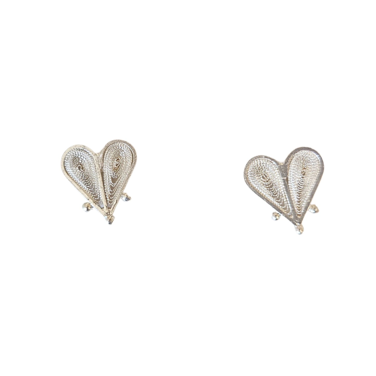 Heart-shaped earrings with intricate design on a white background