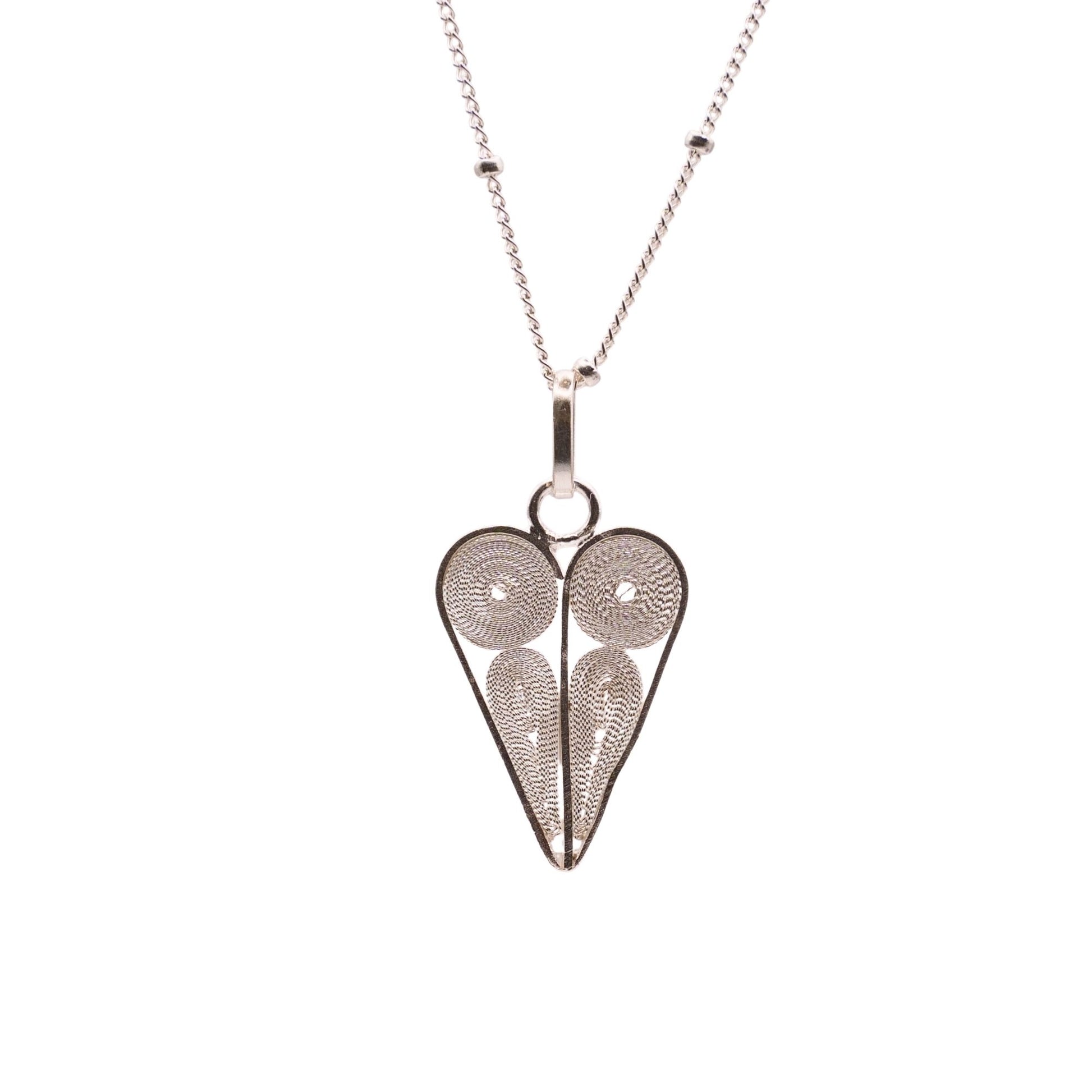 Heart-shaped pendant necklace on a white background