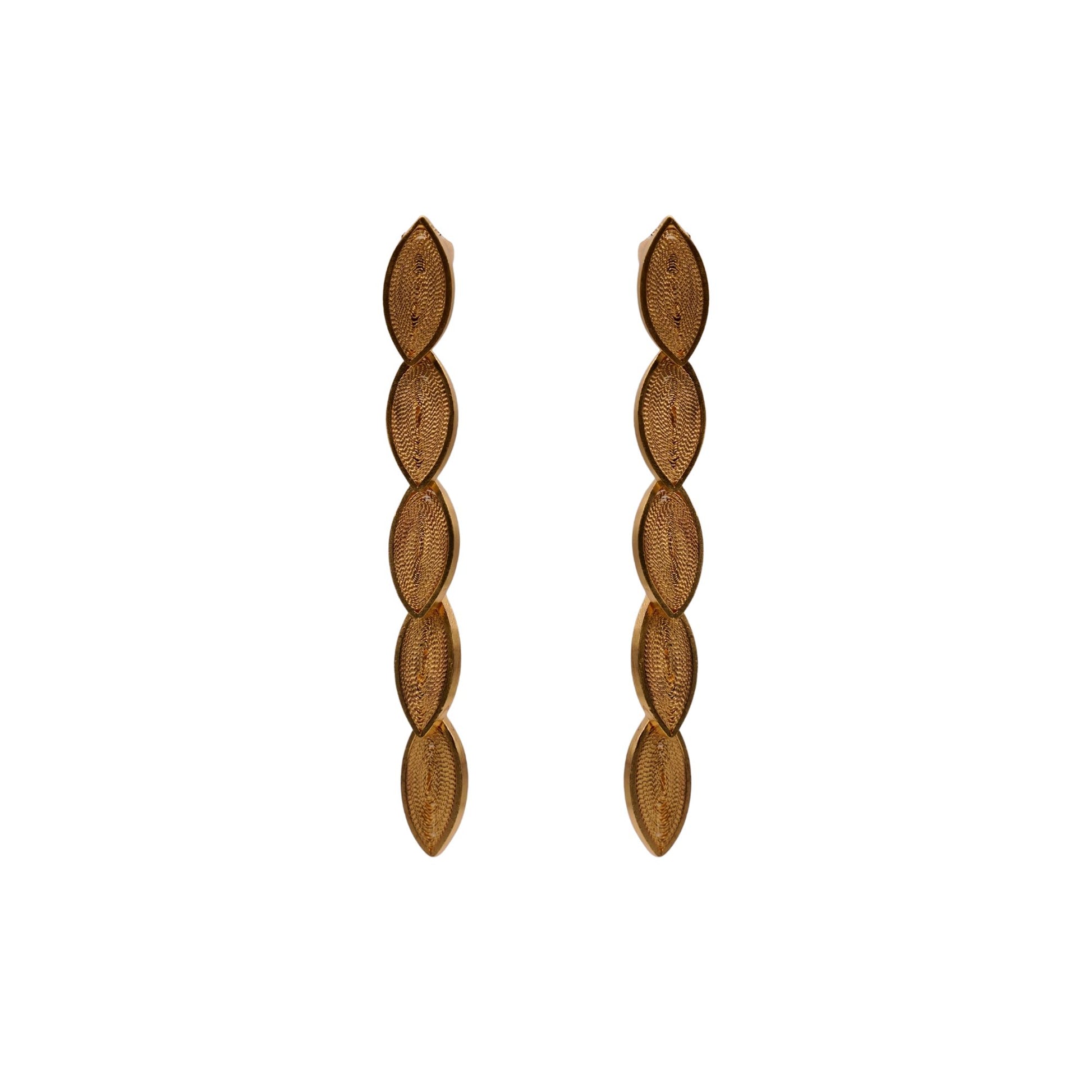 Pair of gold leaf-shaped earrings on a white background