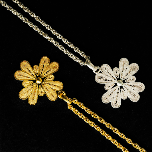 Oh Voila Jewelry Lucky Charm flower necklaces in filigree design, handmade in 950 silver and 18K gold vermeil, displayed on twisted chains.