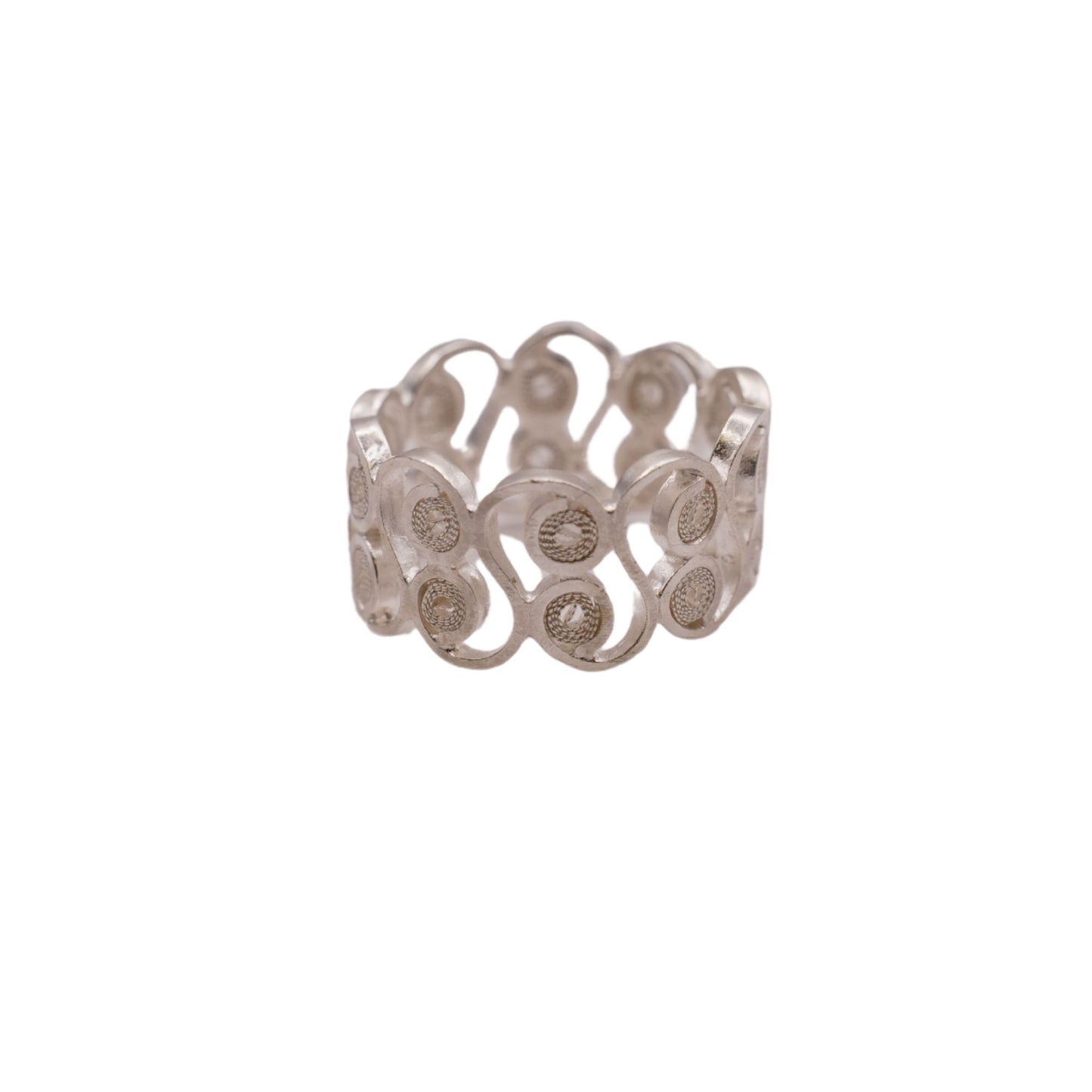 Silver ring with intricate design on a white background