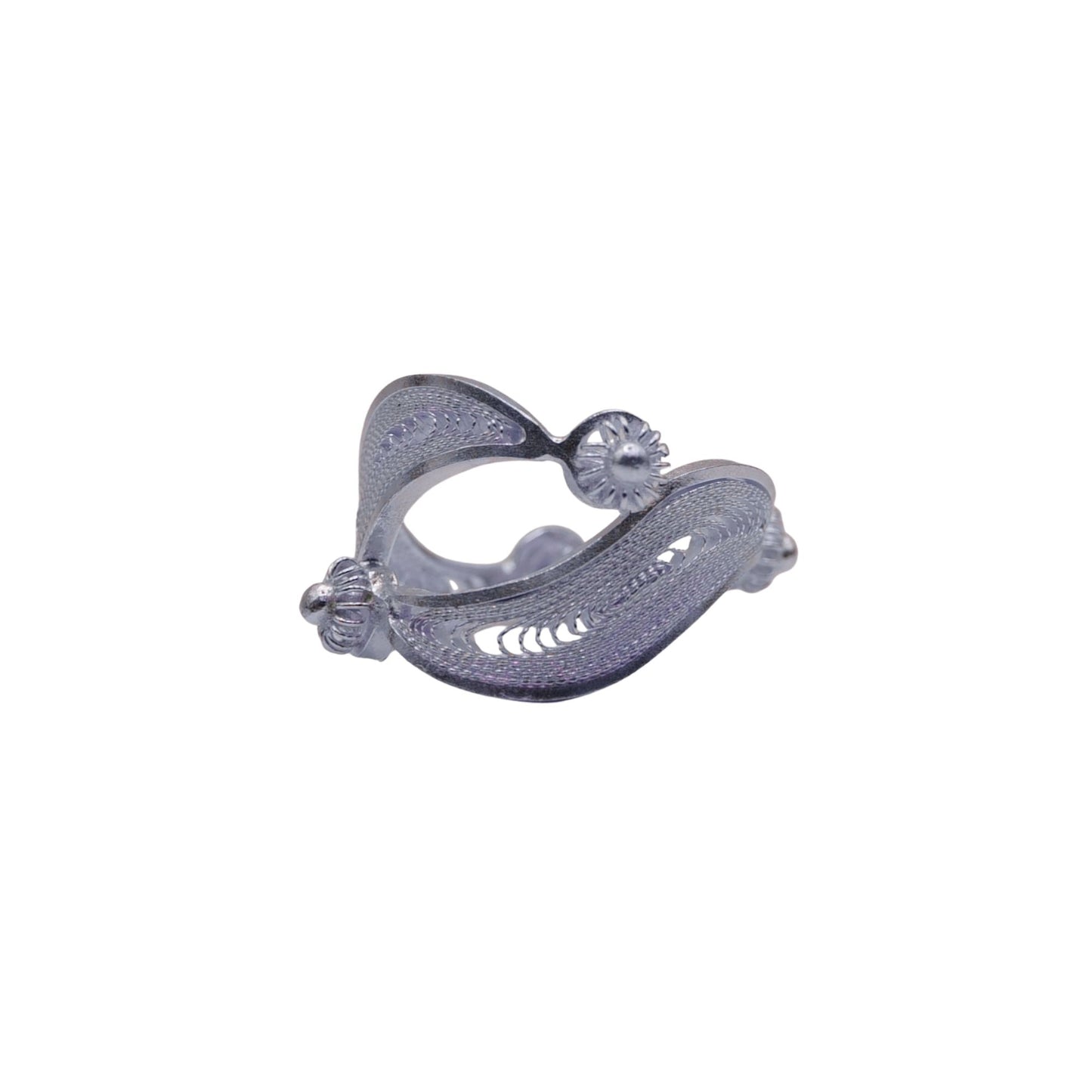 Silver ear cuff with intricate design on a white background